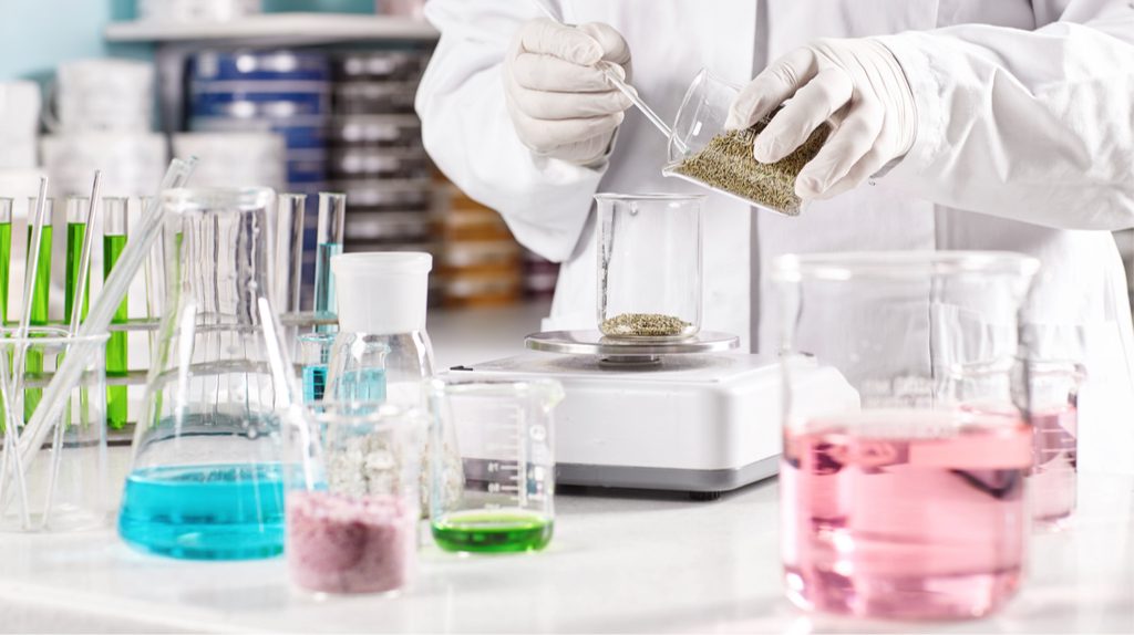 A lab professional working with chemicals and other substances. 