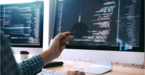 Man on computer looking at software modeling and design. 